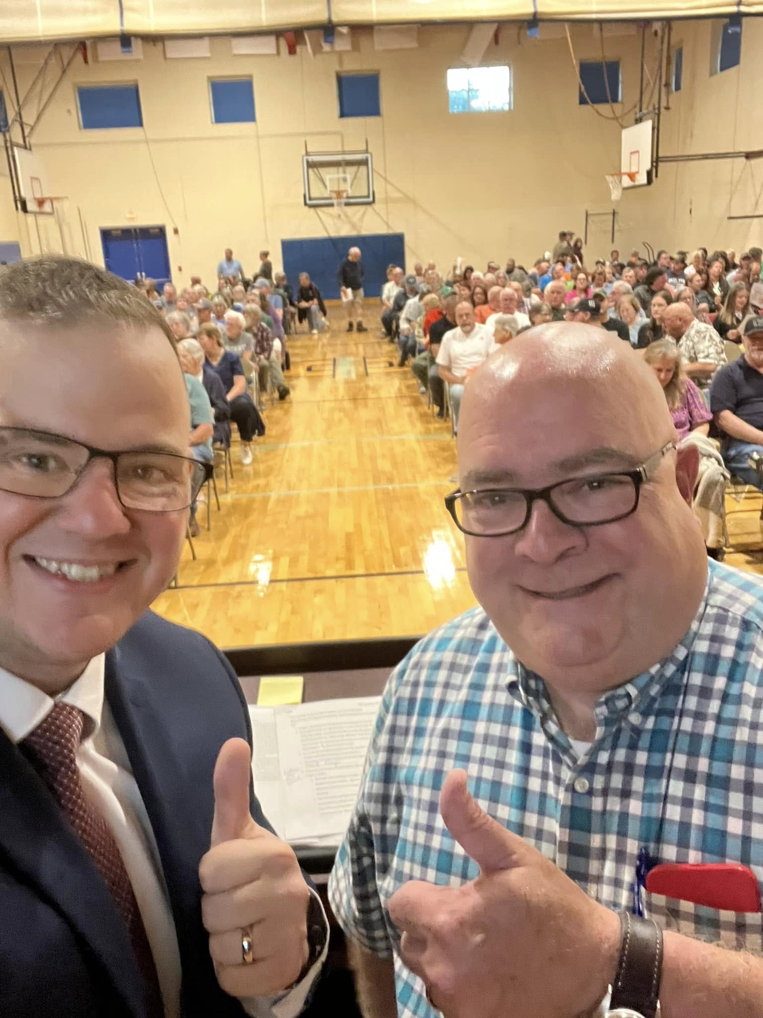 Nathan Boudreau with supporters at a packed local meeting